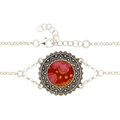 Silver filigree bracelet with red brocade